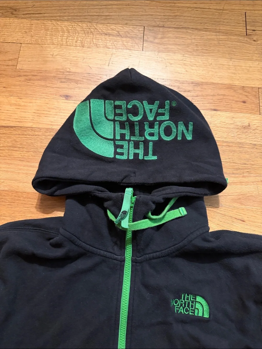 The North Face Black Hoodie with Green Accents